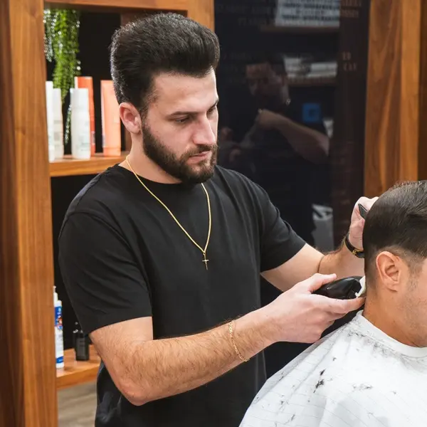 Barber shaving customer