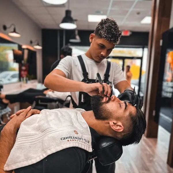 Barber shaving customer