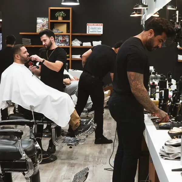 Barber shaving customer